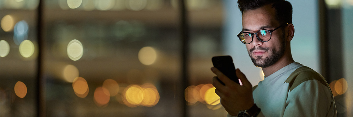 An investor inspects the performance chart of an ETF on their phone